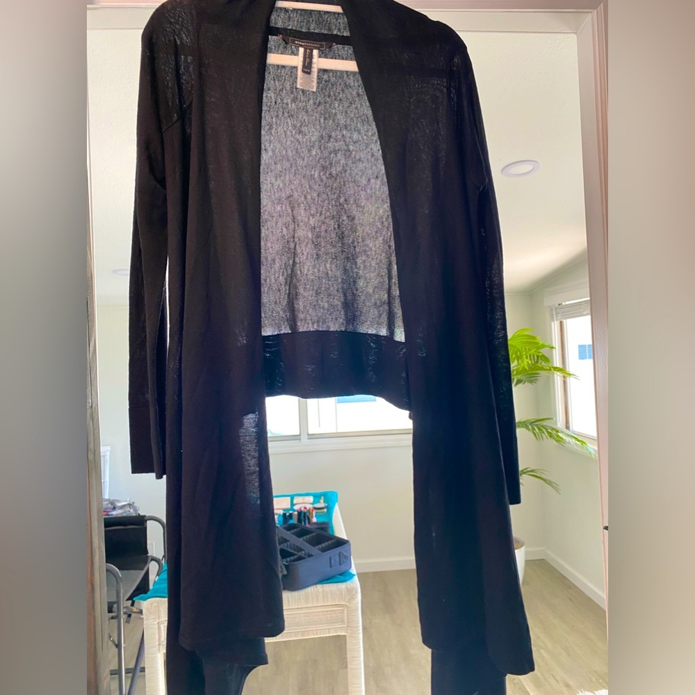 BCBG Black sweater wrap. One small hole…. NEVER WORN.